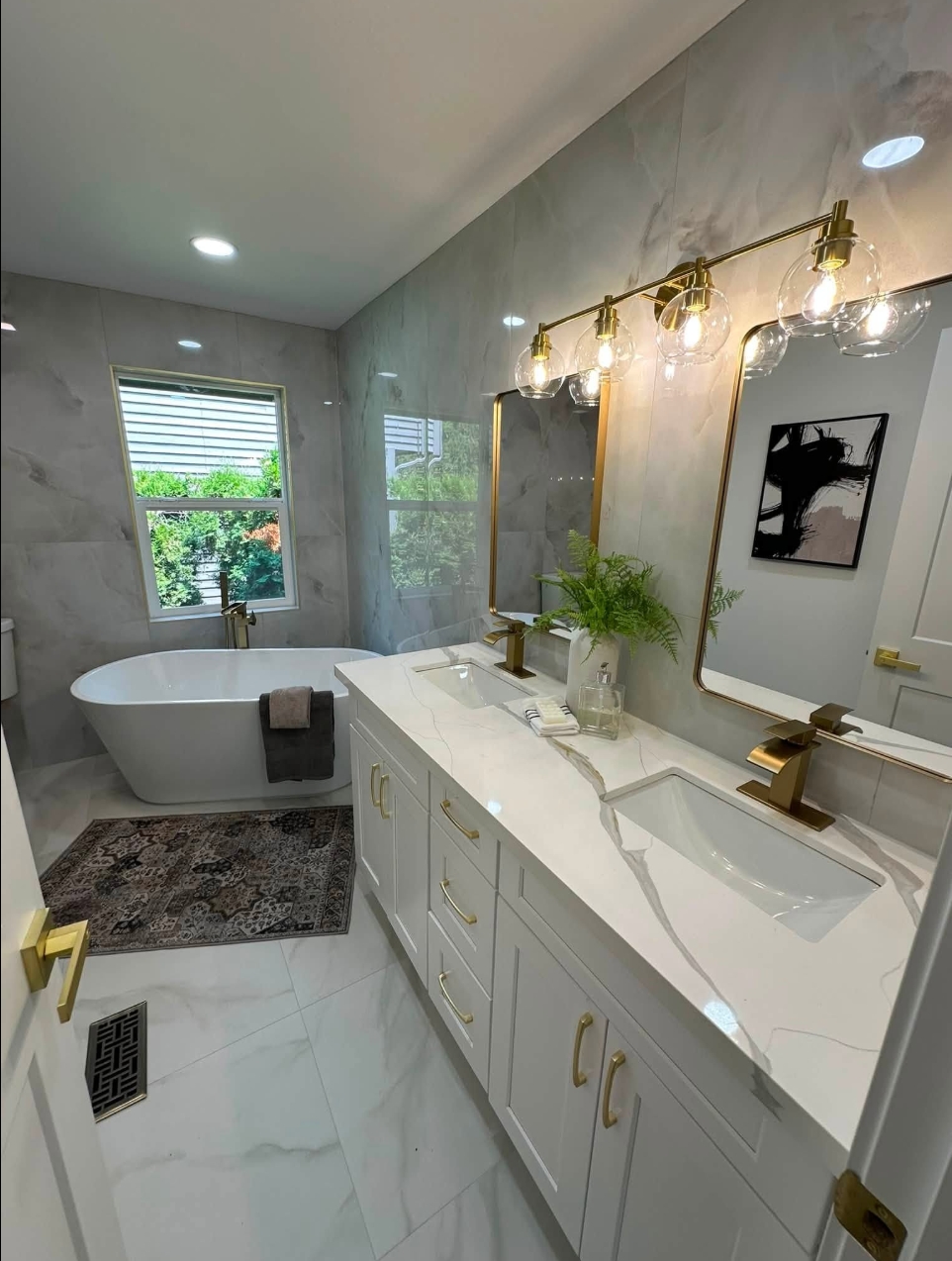 Luxury bathroom remodel with double vanity and freestanding tub